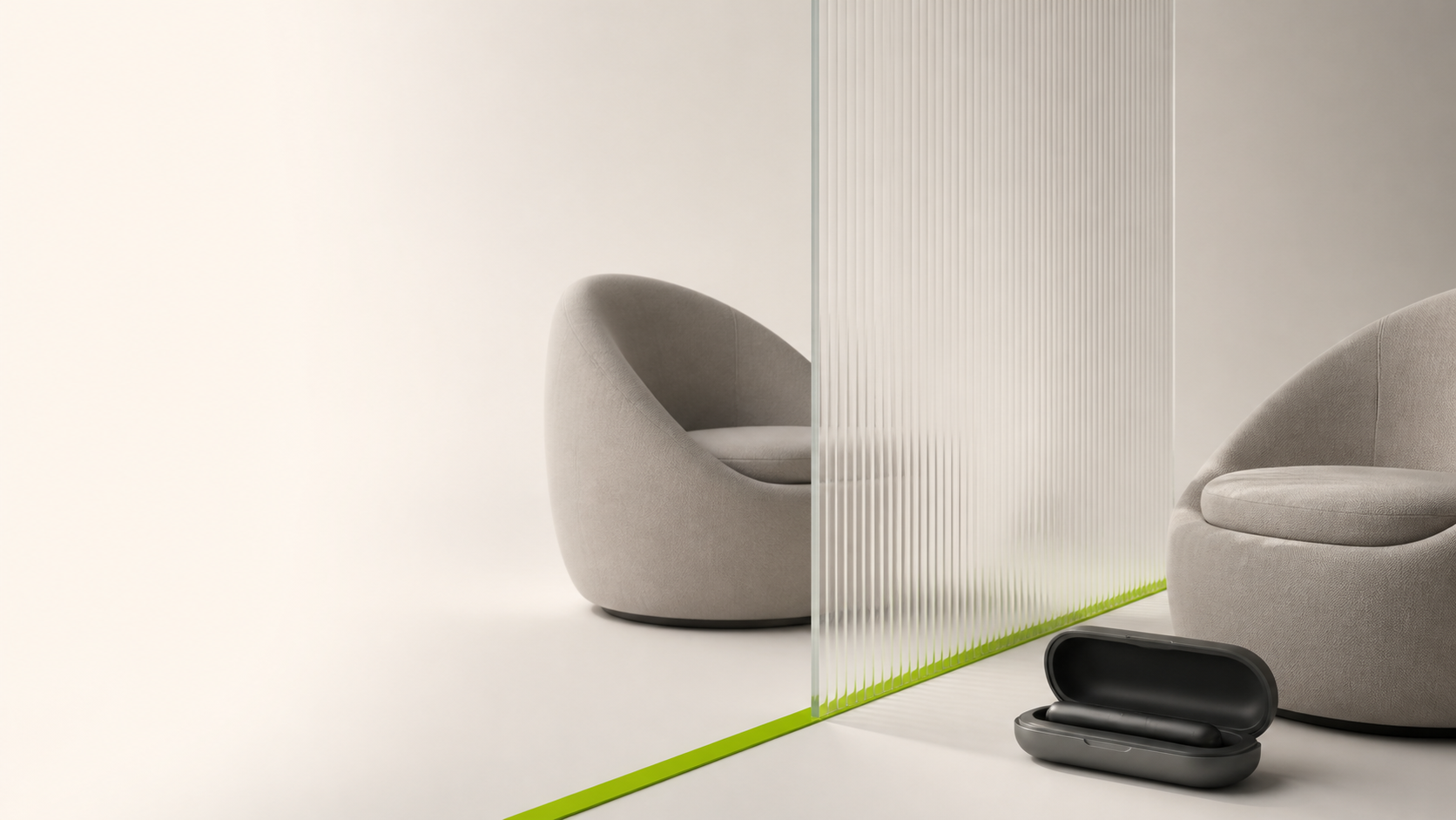Closed vape device in a case beside two lounge chairs separated by glass
